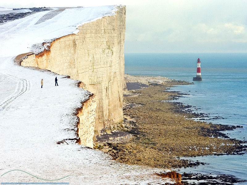 slides/Beachy Head Lighthouse.jpg winter sussex east snow coast beachy head lighthouse eastbourne rocks water ocean people person clouds storm cliffs pebbles red white blue Beachy Head Lighthouse
